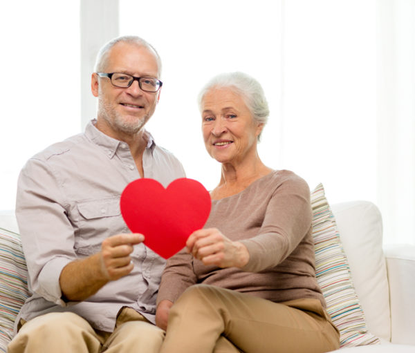 Couple with paper valentine heart