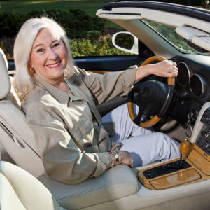 senior woman sitting in driver